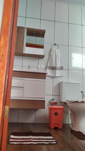 a bathroom with a sink and a toilet at Pousada Mirante Das Serras Ibicoara-BA in Ibicoara