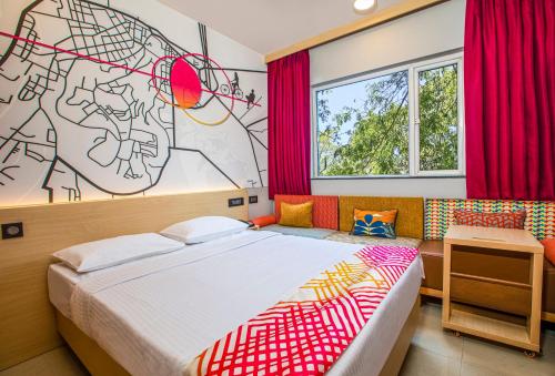 Postel nebo postele na pokoji v ubytování Ginger Bangalore- Whitefield