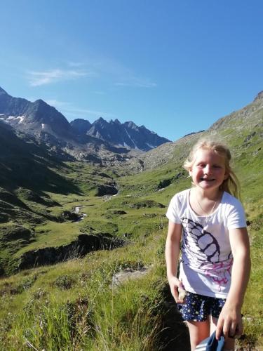 a little girl standing on top of a mountain at Apartment Lacklhof in Großkirchheim