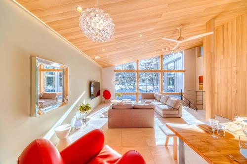 a living room with a couch and a table at Hakuba Amber Resort by Jade Group in Hakuba