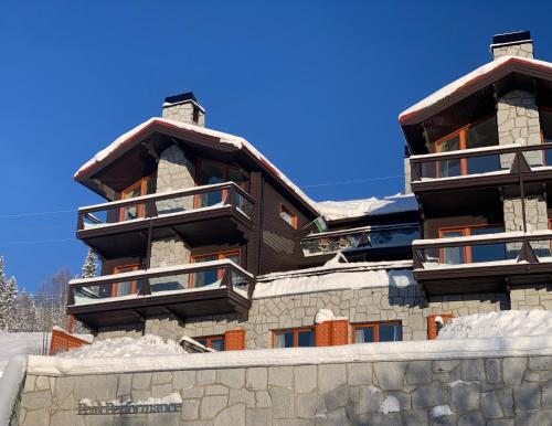 a large building with snow on the ground at Åre Travel - Tottbacken in Åre