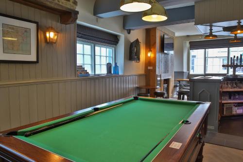 a billiard table in a pub with a pool table at The Seale Arms in Dartmouth