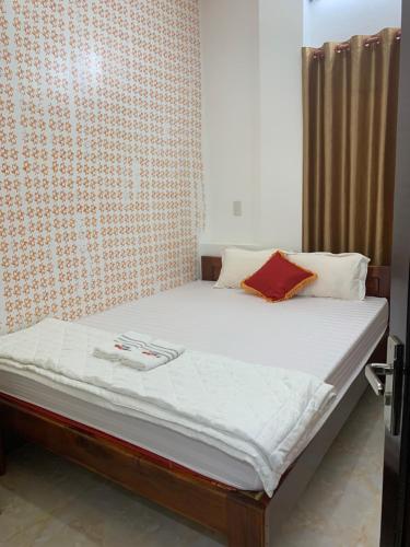 Postel nebo postele na pokoji v ubytování โรงแรมฮั่นฟาด 9 - Hostel Hạnh Phát 9