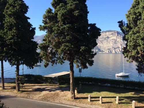 a view of a lake with a boat in the water at Appartamento Fiocco in Malcesine