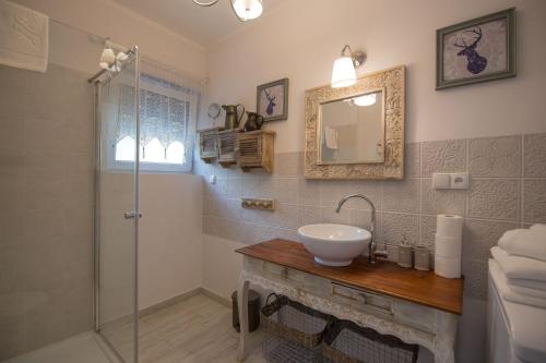 a bathroom with a sink and a shower at Apartamenty Na Szczycie z balkonem - Dream Apart in Szczyrk