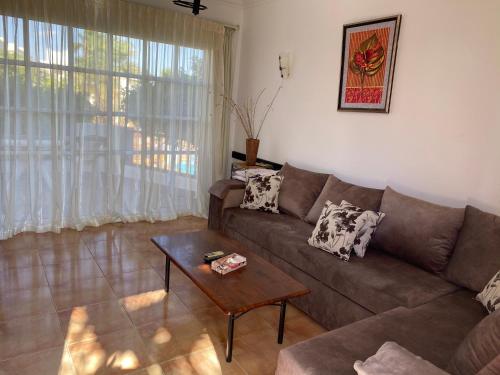 a living room with a couch and a table at Delta Sharm Apartment in Sharm El Sheikh