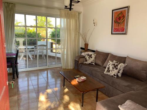 a living room with a couch and a table at Delta Sharm Apartment in Sharm El Sheikh