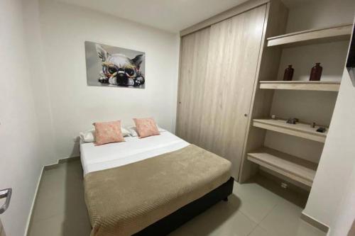 Ένα ή περισσότερα κρεβάτια σε δωμάτιο στο Hermoso Apartamento Ibague 101 F1