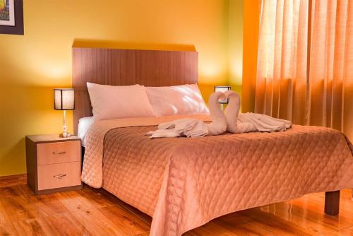 Cama o camas de una habitación en Serk'ana Suite Hostal