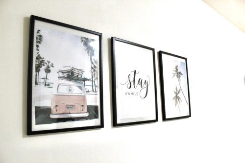 three framed pictures hanging on a wall at Apartment Atria in Vrnjačka Banja