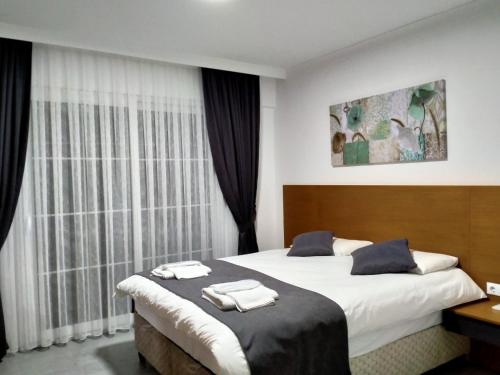 Postel nebo postele na pokoji v ubytování Ada Apart Hotel Göcek