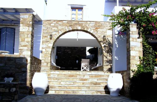 an entrance to a house with an archway at Elena Studios & Apartments in Piso Livadi