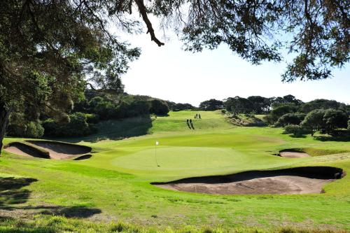 a view of a golf course with a green at Mercure Portsea & Portsea Golf Club in Portsea