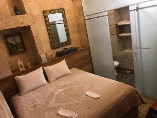 En eller flere senge i et værelse på Gazel Butik Otel