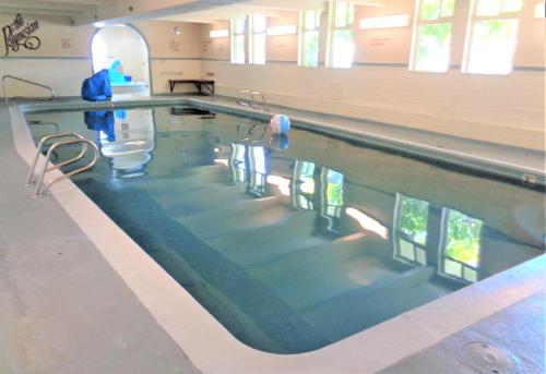 a swimming pool in a building with the water at The Polynesian Resort in Ocean Shores