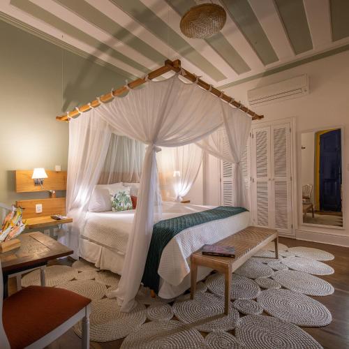 Ein Bett oder Betten in einem Zimmer der Unterkunft Sandi Hotel
