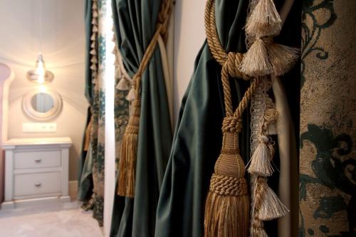 a group of curtains hanging in a room at Casa Hermanni in Sibiu