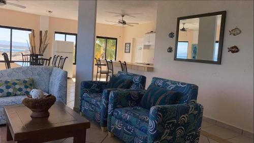 a living room with a couch and a table at Villa Paraíso in La Ventana