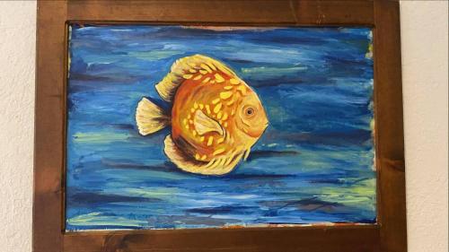 a painting of a gold fish in the water at Villa Paraíso in La Ventana
