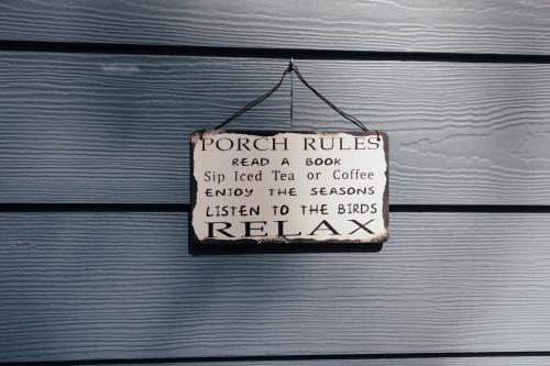 a sign is hanging on a garage door at Hoh Valley Cabins in Forks