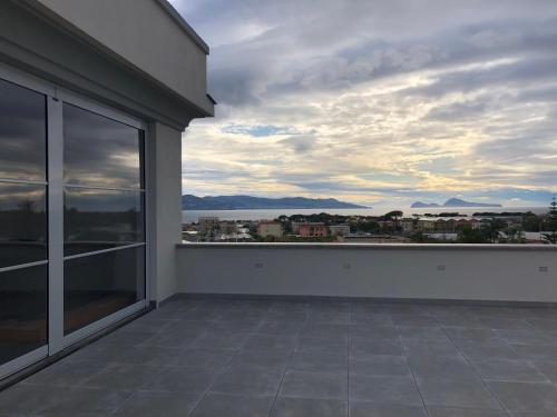 an empty balcony with a view of a city at Palazzo Marage in Torre del Greco