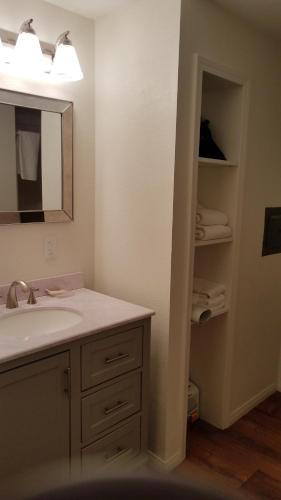 a bathroom with a sink and a mirror at Shoshone Inn in Shoshone