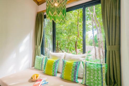 Кровать или кровати в номере Koh Yao Yai Village