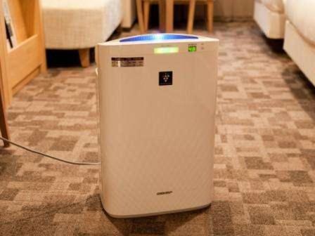 a small white refrigerator sitting on a floor at Almont Hotel Kyoto in Kyoto