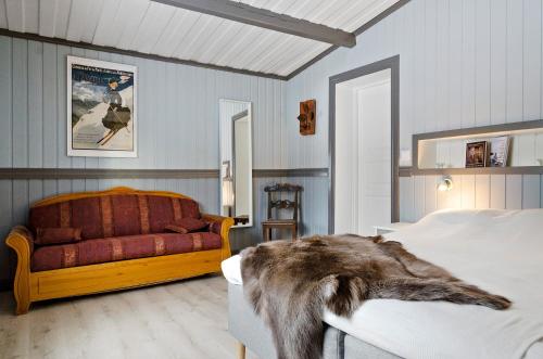 Säng eller sängar i ett rum på Vålkojan Naturby - Timber cottages