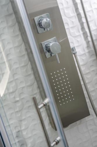 a shower in a room with a bed at Feel like an Emperor Apartments in Split
