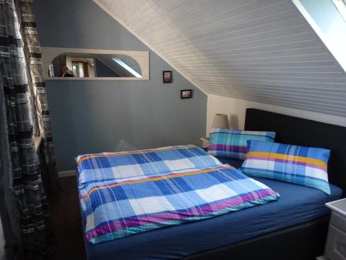 a bedroom with a bed and a mirror at Miramar in Dahme