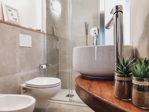 a bathroom with a sink and a toilet at Antica Torre del Borgo in Certaldo