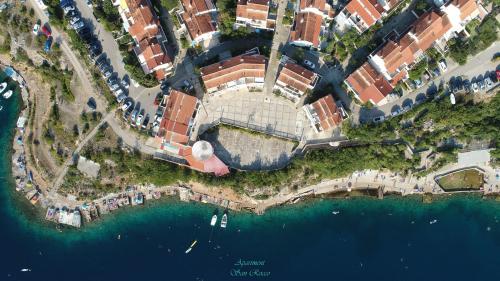 an aerial view of a building next to the water at Apartment San Rocco in Stinica