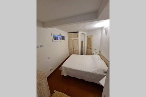 Ένα ή περισσότερα κρεβάτια σε δωμάτιο στο Casa Mariu' ,con giardino vista mare
