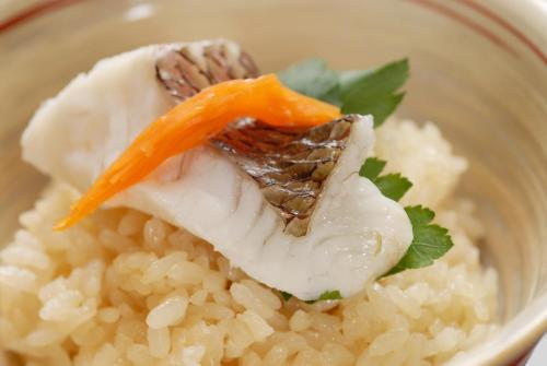 a bowl of rice with a carrot on top at Dogo Prince Hotel in Matsuyama