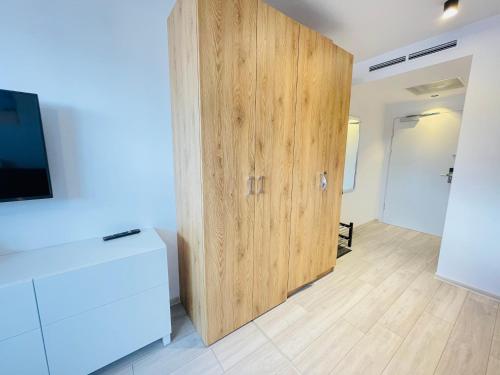 Televízia a/alebo spoločenská miestnosť v ubytovaní BalticSea Apartamenty