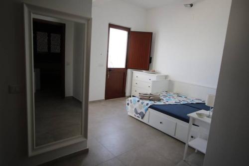 Ένα ή περισσότερα κρεβάτια σε δωμάτιο στο Il Giglio di mare