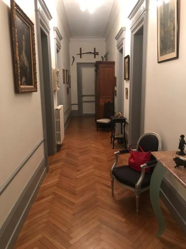 a hallway in a house with wooden floors at CHATEAU D HUGLEVILLE in Hugleville-en-Caux