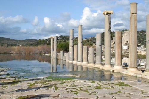 a row of columns in a body of water at Sea view Bougainvillea 52 in Kalkan