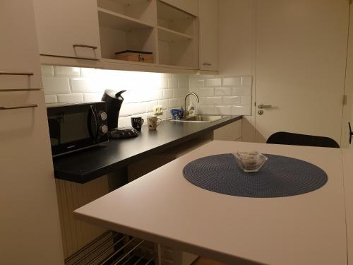 a kitchen with a table with a bowl on it at Studio "Shoshana" Harderwijk in Harderwijk