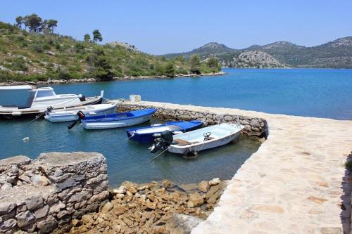 a group of boats are docked in the water at Holiday home Nature park - relaxing and comfortable in Sali