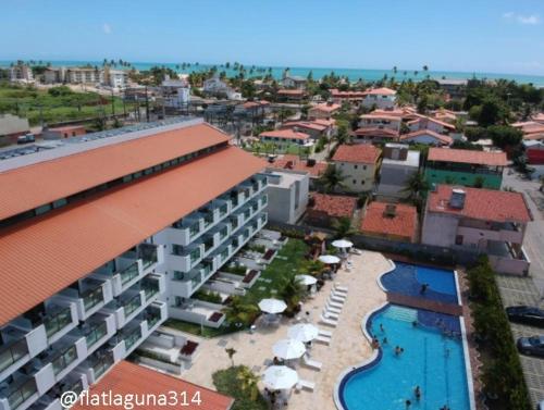 an aerial view of a resort with a swimming pool at Laguna Beach Flat 314- Porto de Galinhas in Porto De Galinhas