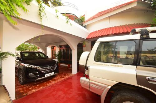 a white truck parked in front of a house at VILLA MARINAA 6 Rooms property in Puducherry