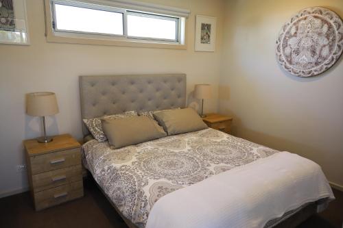 a bedroom with a bed and a window at Sedekah on Bristol in Torquay