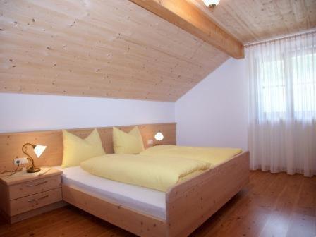 Кровать или кровати в номере Apartments Feldsagerhof