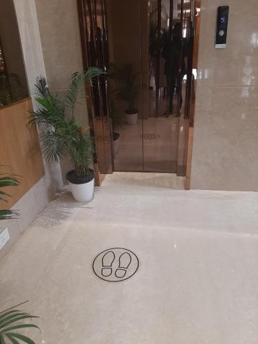 a drain in the floor of a building with plants at Ayra Boutique Hotel in Bengaluru