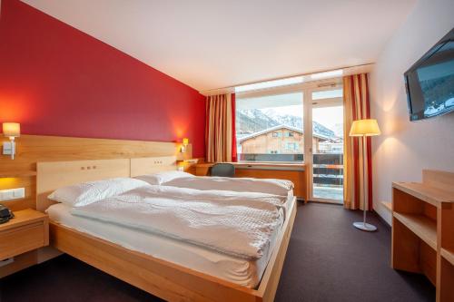 Postel nebo postele na pokoji v ubytování Hotel Gädi
