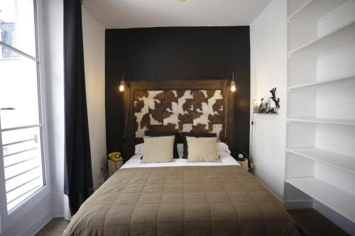 Postel nebo postele na pokoji v ubytování L'APPART LE 5