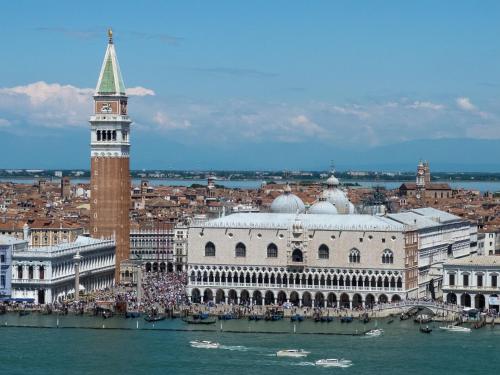 a large building with a clock tower in a city at B&B Cà del Poeta in Venice