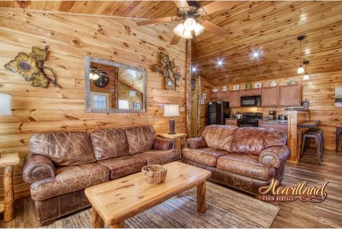 a living room with a couch and a table at Southern State of Mind in Pigeon Forge